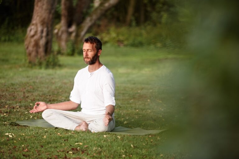 Yoga, health and meditation with man in nature for lotus pose, peace and exercise balance.